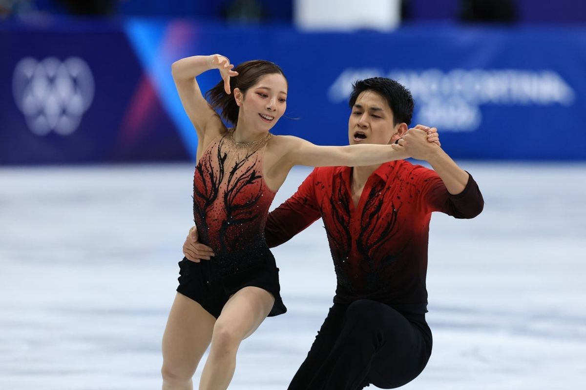 Feb 15, 2026; Milan, Italy; Riku Miura and Ryuichi Kihara of Japan compete in the pairs skating short program during the Milano Cortina 2026 Olympic Winter Games at Milano Ice Skating Arena. Mandatory Credit: Katie Stratman-Imagn Images