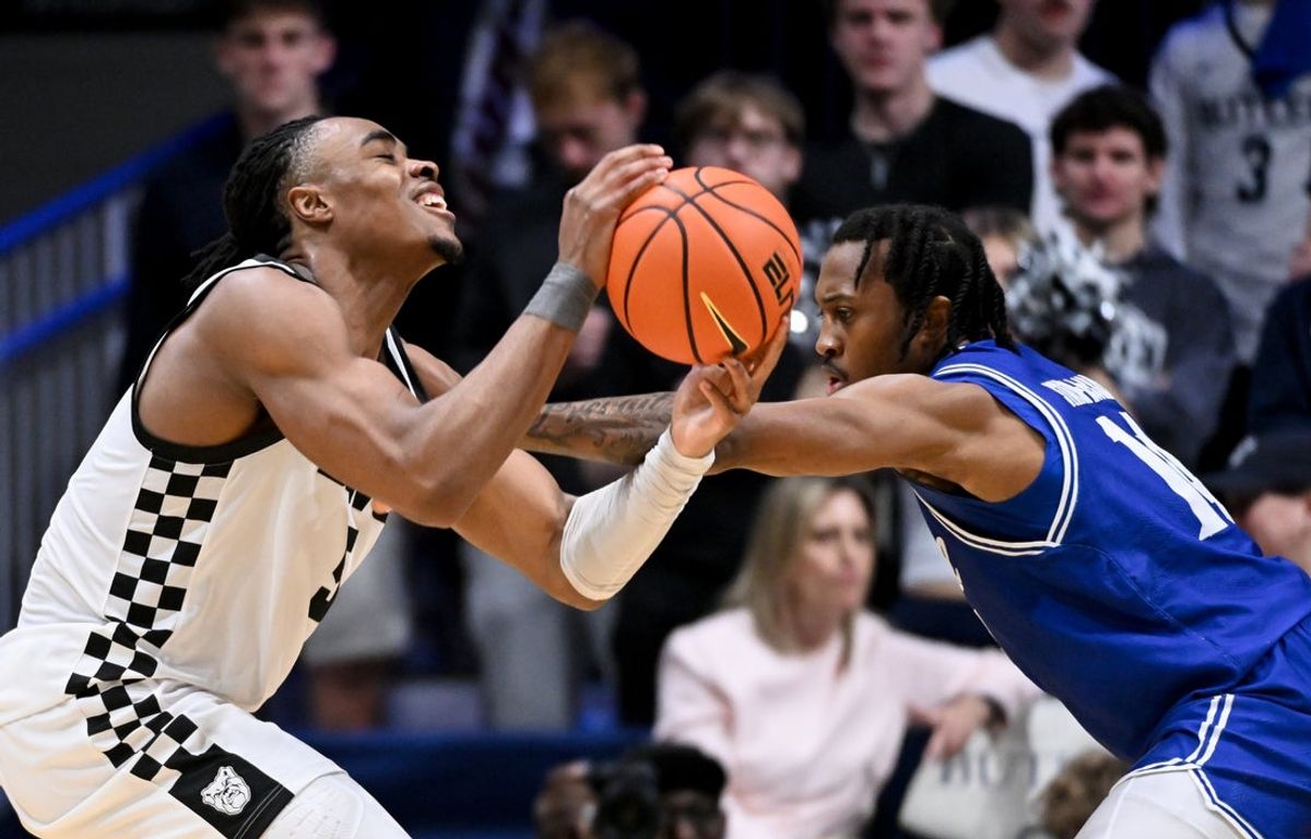 Feb 15, 2026; Indianapolis, Indiana, USA; Seton Hall Pirates guard AJ Staton-McCray (14) fouls Butler Bulldogs forward Michael Ajayi (5) during the first half at Hinkle Fieldhouse. Mandatory Credit: Robert Goddin-Imagn Images