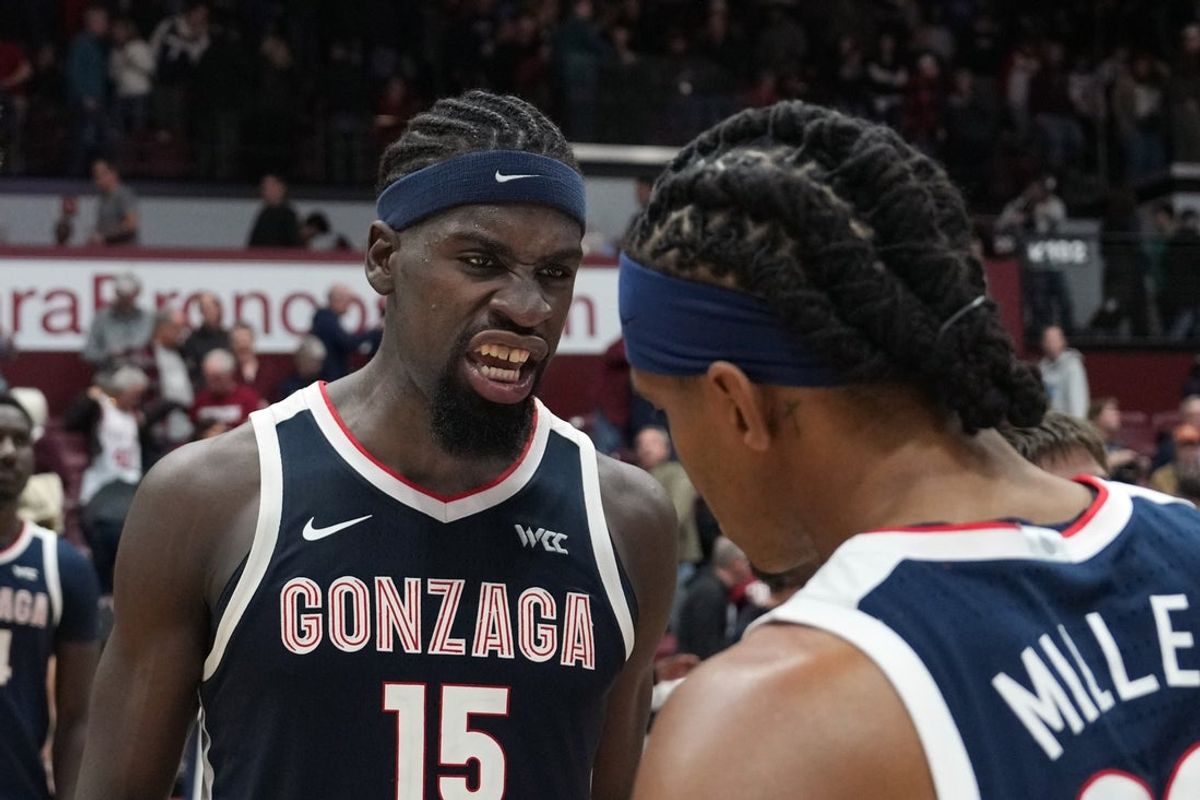 Feb 14, 2026; Santa Clara, California, USA; Gonzaga Bulldogs forward Graham Ike (15) celebrates with guard Adam Miller (right) after defeating the Santa Clara Broncos at Leavey Center. Mandatory Credit: Darren Yamashita-Imagn Images