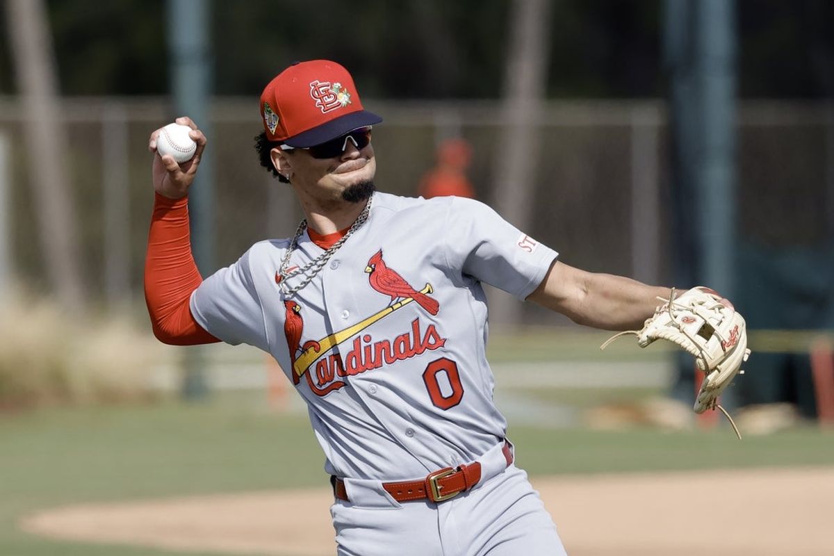 Feb 16, 2026; Jupiter, FL, USA; St. Louis Cardinals shortstop Masyn Winn (0) throws during spring training workouts at Roger Dean Stadium. Mandatory Credit: Reinhold Matay-Imagn Images