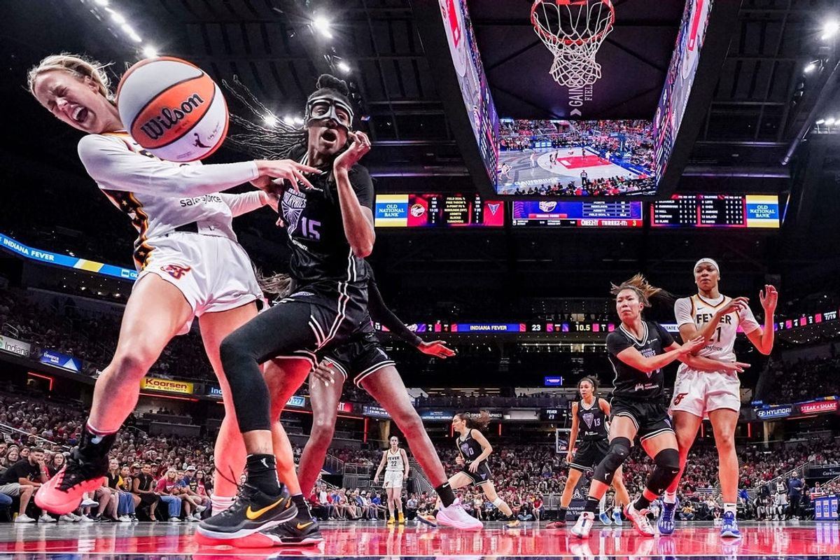 Indiana Fever guard Sophie Cunningham (8) and Golden State Valkyries guard Tiffany Hayes (15) go for the ball during a game between the Indiana Fever and the Golden State Valkyries at Gainbridge Fieldhouse in Indianapolis, Ind., on Wednesday, July 9, 2025. The Valkyries defeated the Fever, 80-61.