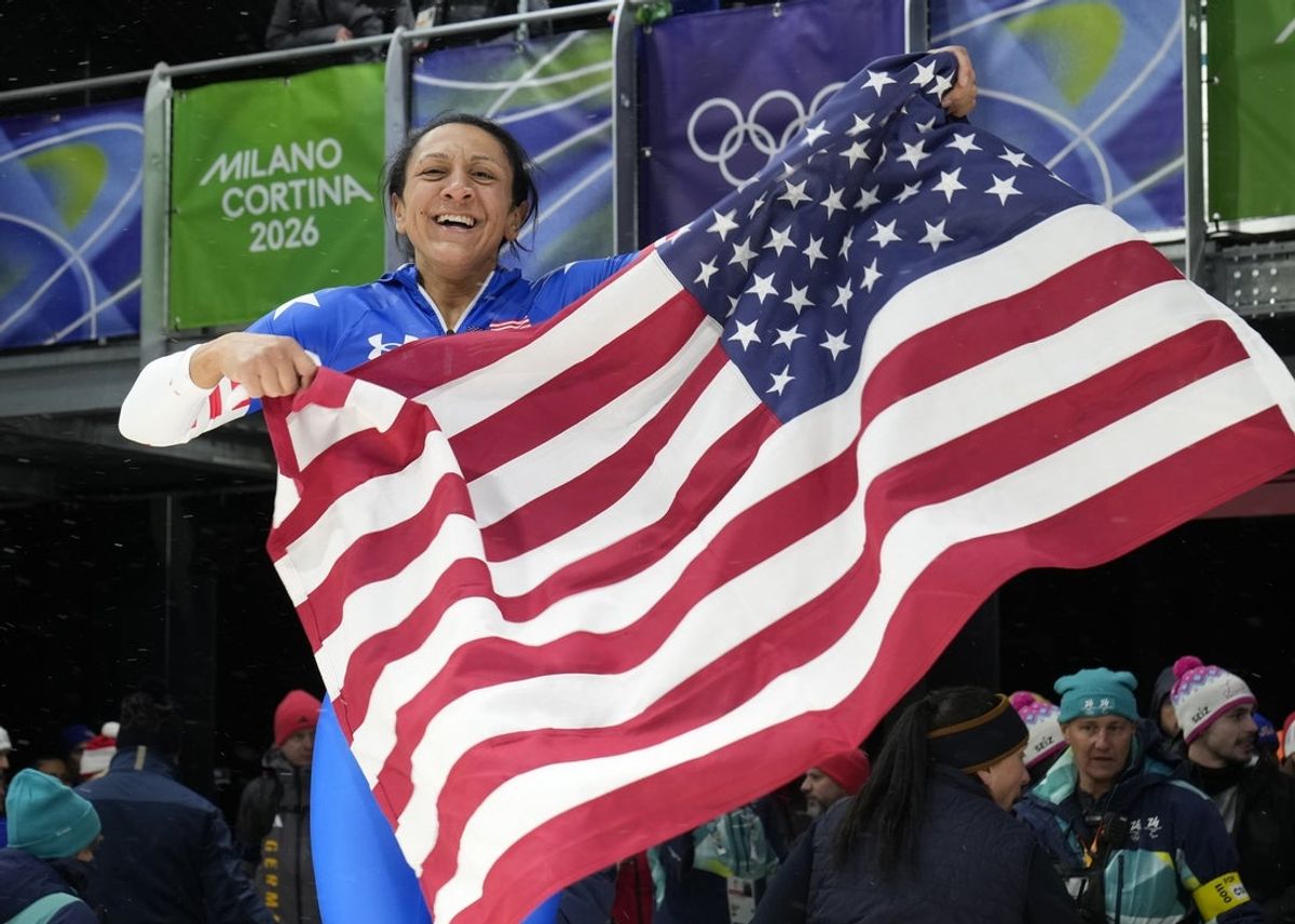 Feb 16, 2026; Cortina d'Ampezzo, Italy; Elana Meyers Taylor of the United States celebrates after winning the women's bobsleigh monobob competition during the Milano Cortina 2026 Olympic Winter Games at Cortina Sliding Centre. Mandatory Credit: Michael Madrid-Imagn Images