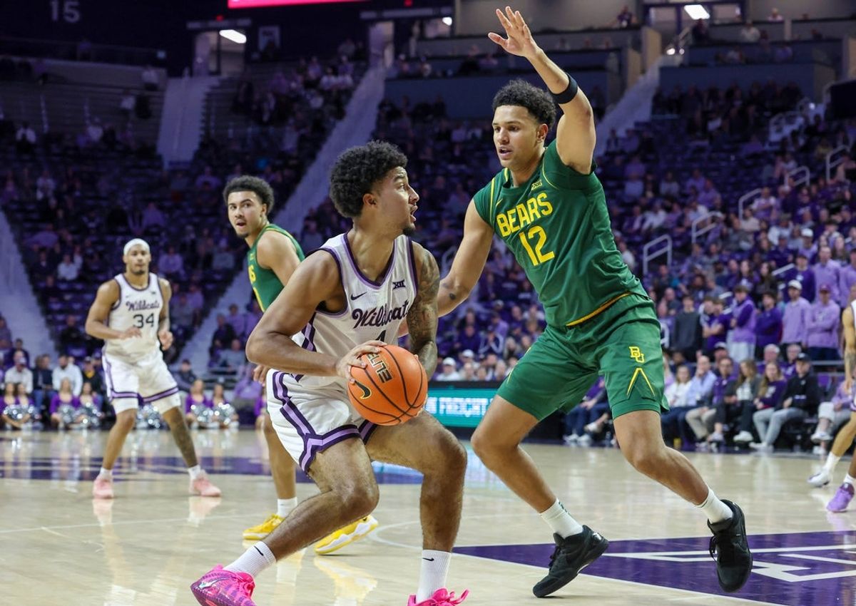 Feb 17, 2026; Manhattan, Kansas, USA; Kansas State Wildcats guard P.J. Haggerty (4) is guarded by Baylor Bears guard Michael Rataj (12) during the first half at Bramlage Coliseum. Mandatory Credit: Scott Sewell-Imagn Images