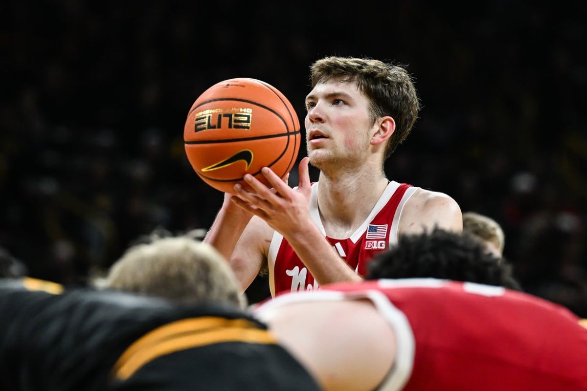 Feb 17, 2026; Iowa City, Iowa, USA; Nebraska Cornhuskers forward Pryce Sandfort (21) shoots a free throw against the Iowa Hawkeyes during the first half at Carver-Hawkeye Arena. Mandatory Credit: Jeffrey Becker-Imagn Images