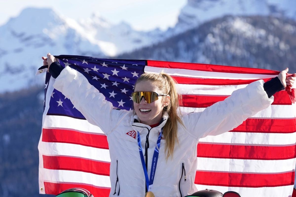 Feb 18, 2026; Cortina d'Ampezzo, Italy; Gold medalist Mikaela Shiffrin of the United States celebrates after the women's slalom during the Milano Cortina 2026 Olympic Winter Games at Tofane Alpine Skiing Centre. Mandatory Credit: Michael Madrid-Imagn Images