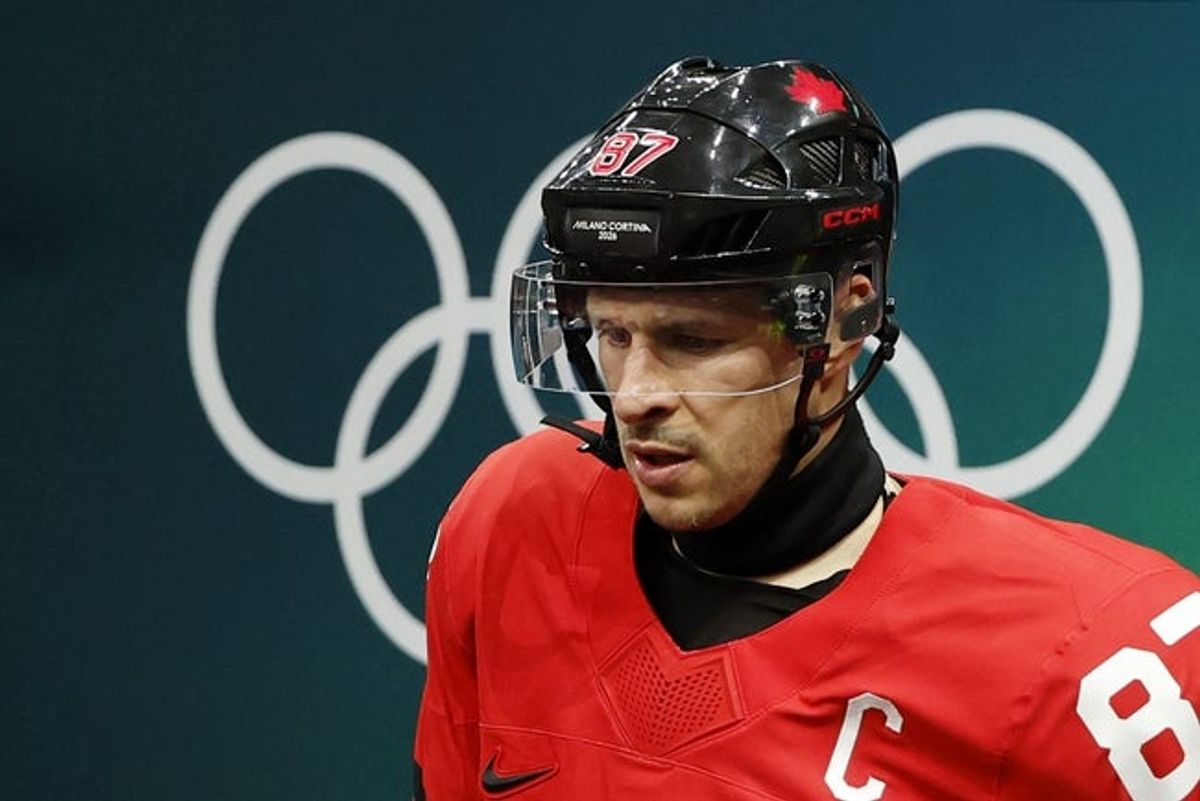 Feb 18, 2026; Milan, Italy; Sidney Crosby of Canada walks out to the ice before a men's ice hockey quarterfinal during the Milano Cortina 2026 Olympic Winter Games at Milano Santagiulia Ice Hockey Arena. Mandatory Credit: Geoff Burke-Imagn Images