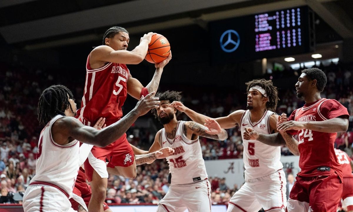Feb 18, 2026; Tuscaloosa, AL, USA; Alabama forward Amari Allen (5) rebounds over several Alabama players at Coleman Coliseum. Mandatory Credit: Gary Cosby Jr.-Tuscaloosa News