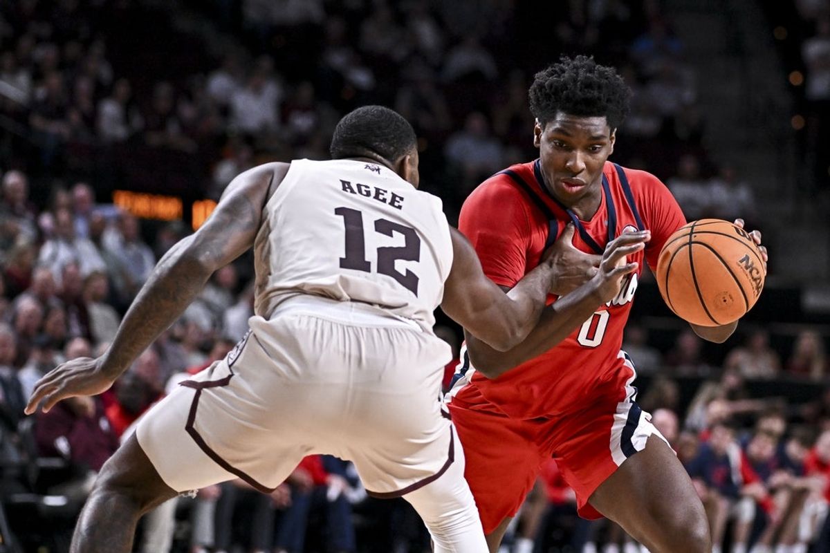 Feb 18, 2026; College Station, Texas, USA; Ole Miss Rebels forward Malik Dia (0) drives as Texas A&M Aggies forward Rashaun Agee (12) defends during the first half at Reed Arena. Mandatory Credit: Maria Lysaker-Imagn Images