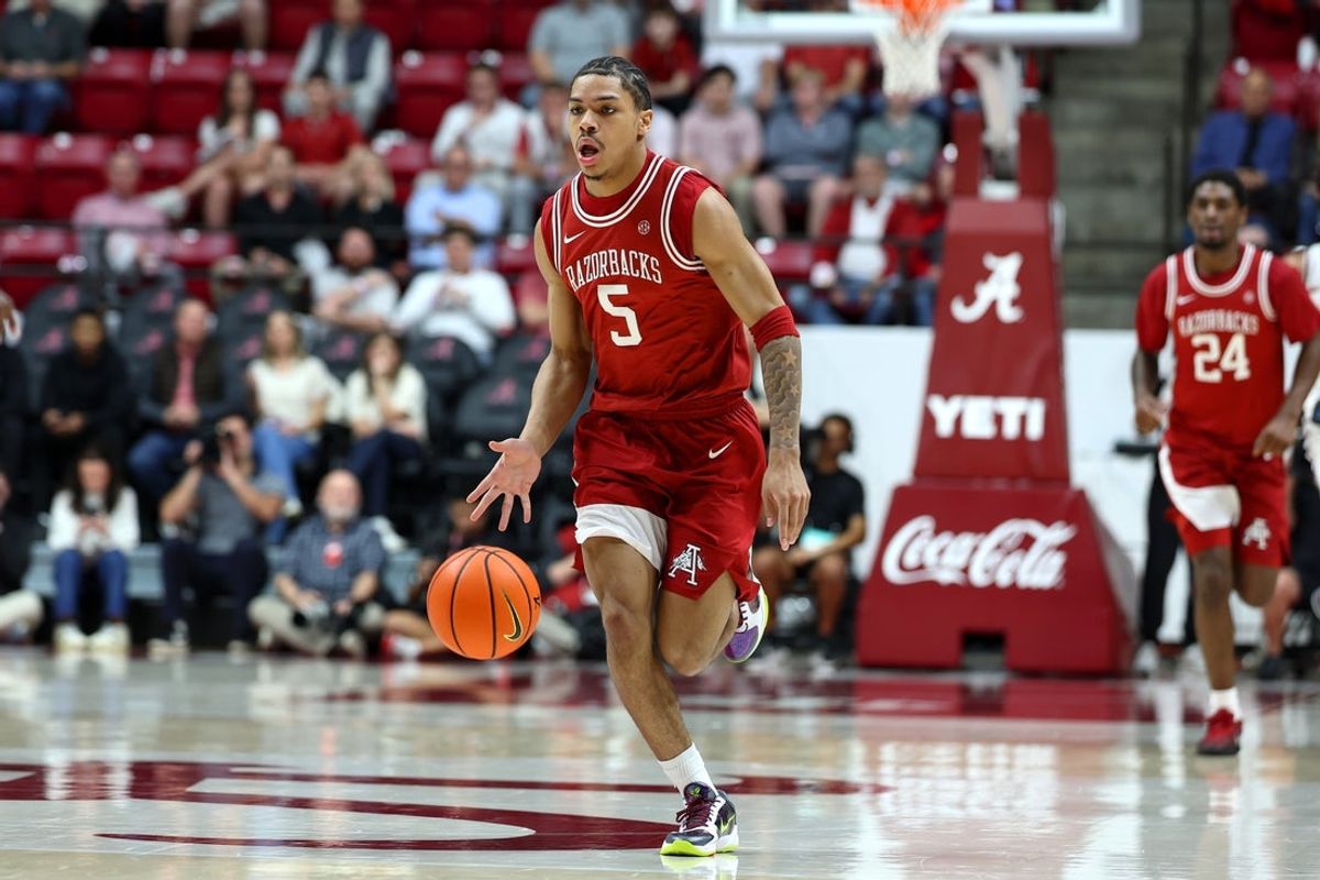 Feb 18, 2026; Tuscaloosa, Alabama, USA; Arkansas Razorback guard Darius Acuff Jr. (5) dribbles a fast break during the first half against the Alabama Crimson Tide at Coleman Coliseum. Mandatory Credit: David Leong-Imagn Images