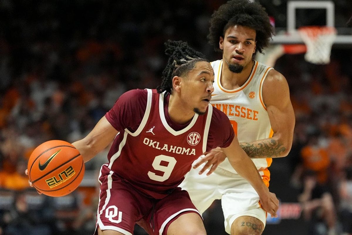 Oklahoma guard Nijel Pack (9) moves the ball while guarded by Tennessee guard Ja’Kobi Gillespie (0) during an NCAA college basketball game on Feb. 18, 2026, in Knoxville, Tennessee.