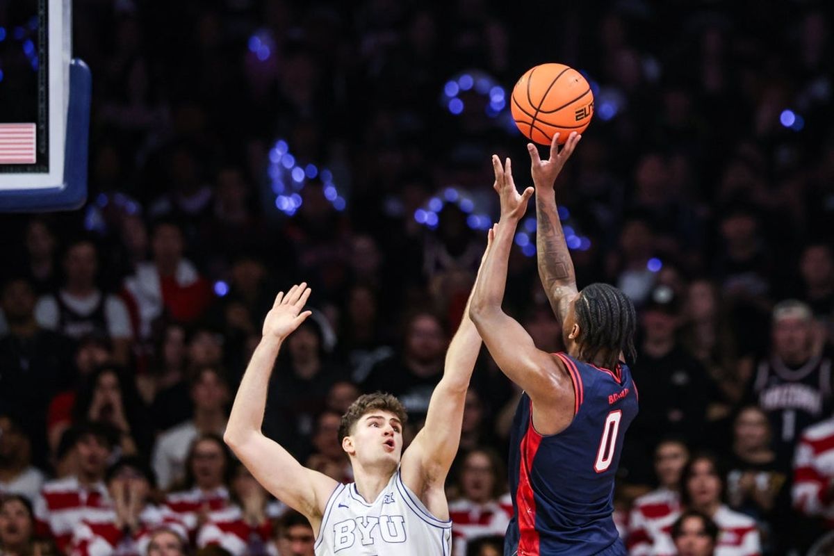 Feb 18, 2026; Tucson, Arizona, USA; Arizona Wildcats guard Jaden Bradley (0) shoots the ball over the Brigham Young Cougars during the first half of the game at McKale Memorial Center. Mandatory Credit: Aryanna Frank-Imagn Images