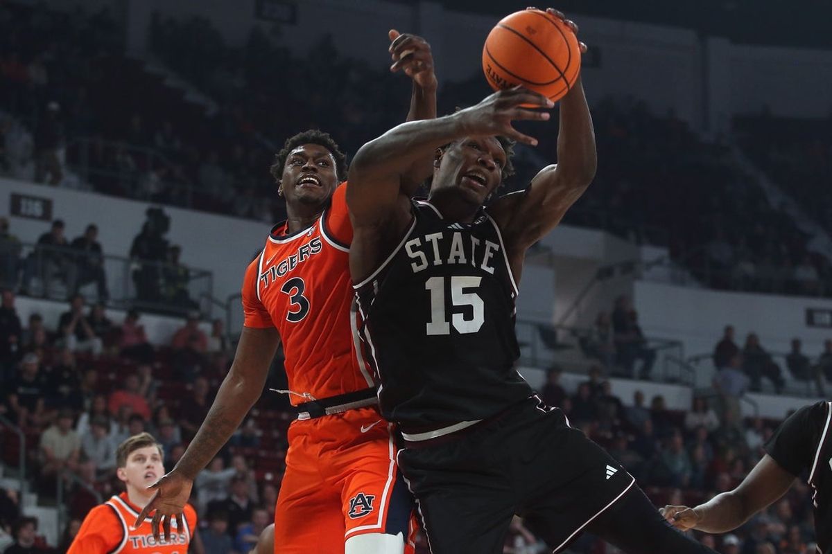 Feb 18, 2026; Starkville, Mississippi, USA; Auburn Tigers forward KeShawn Murphy (3) and Mississippi State Bulldogs center Quincy Ballard (15) battle for a rebound during the first half at Humphrey Coliseum. Mandatory Credit: Petre Thomas-Imagn Images