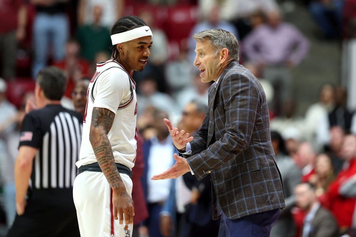 Feb 18, 2026; Tuscaloosa, Alabama, USA; Alabama Crimson Tide head coach Nate Oats speaks with Alabama Crimson Tide guard Labaron Philon (0) during the second half against the Arkansas Razorbacks at Coleman Coliseum. Mandatory Credit: David Leong-Imagn Images