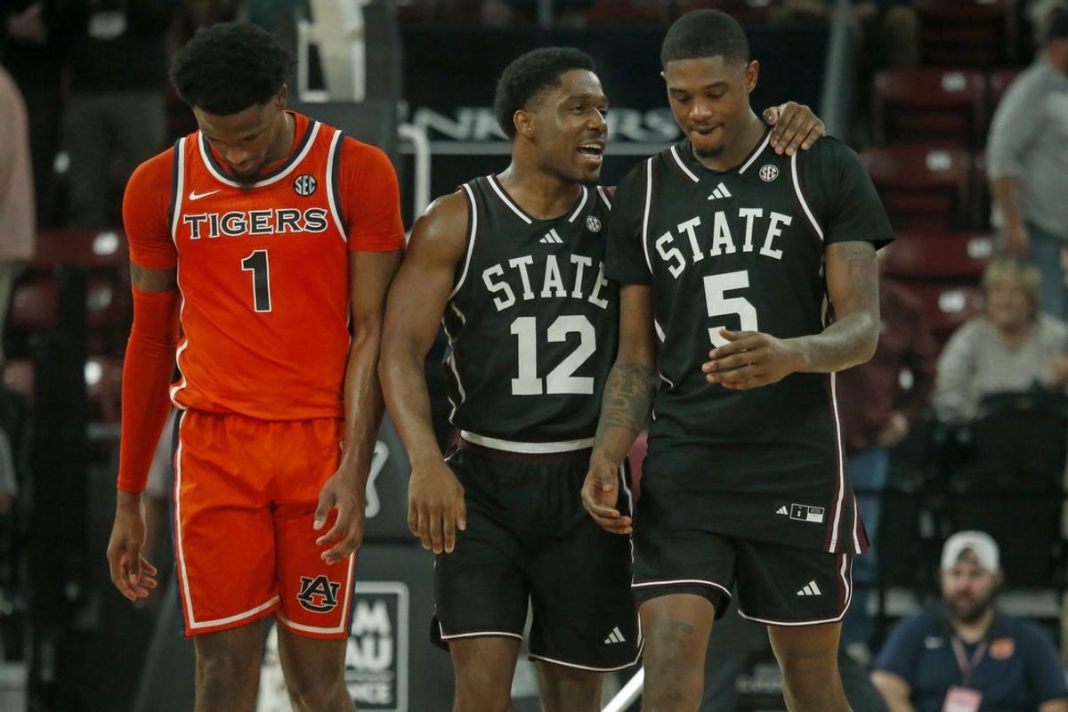 Feb 18, 2026; Starkville, Mississippi, USA; Auburn Tigers guard/forward Kevin Overton (1) reacts as Mississippi State Bulldogs guard Josh Hubbard (12) talks with guard Shawn Jones Jr. (5) in the final seconds during the second half at Humphrey Coliseum. Mandatory Credit: Petre Thomas-Imagn Images