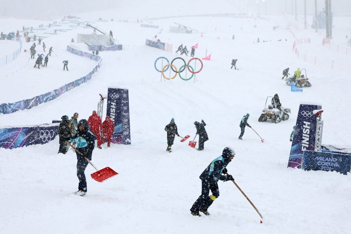 Feb 19, 2026; Bormio, Italy; Workers clear snow from the course before the women's ski mountaineering final during the Milano Cortina 2026 Olympic Winter Games at Stelvio Ski Centre. Mandatory Credit: Nathan Ray Seebeck-Imagn Images