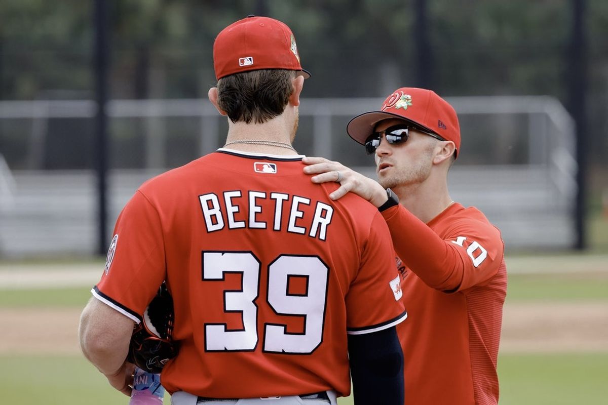 Feb 19, 2026; West Palm Beach, FL, USA;  Washington Nationals manager Blake Butera (10) talks with pitcher Clayton Beeter (39) during spring training workouts at CACTI Park of the Palm Beaches. Mandatory Credit: Reinhold Matay-Imagn Images