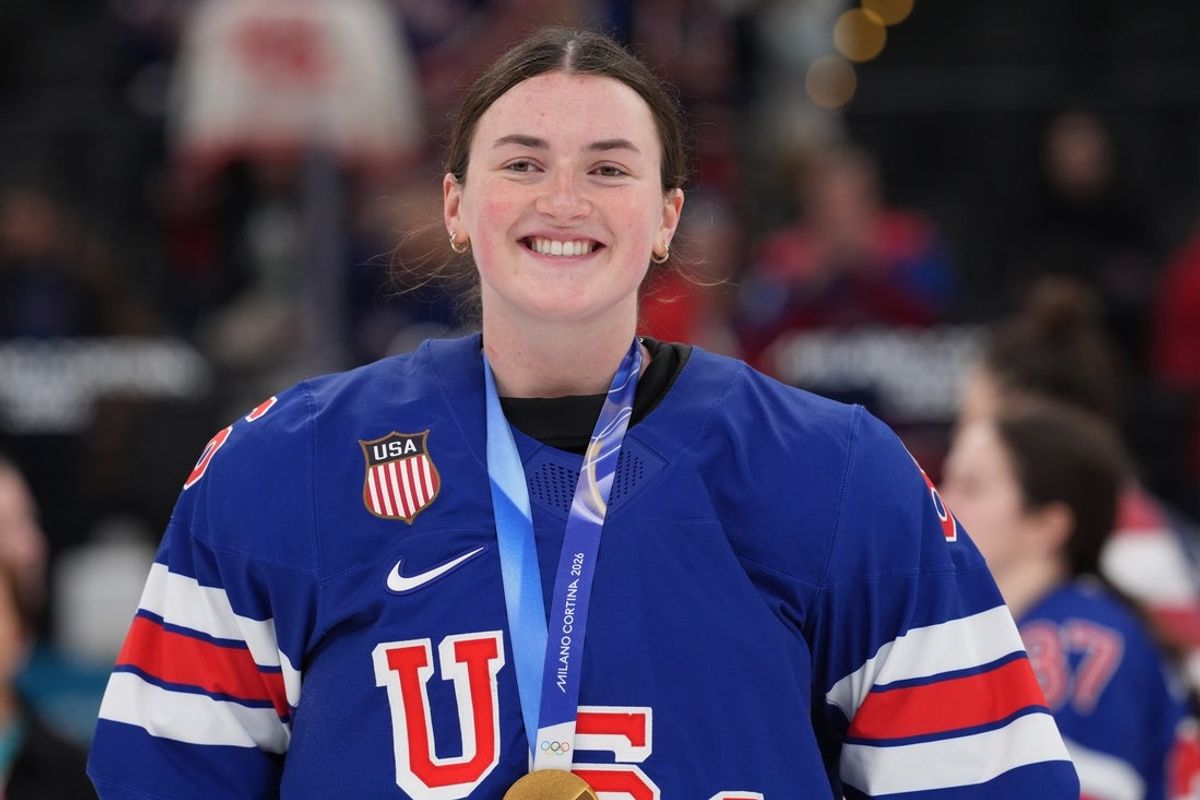 Feb 19, 2026; Milan, Italy; Haley Winn (8) of the United States celebrates after winning the gold medal in women's ice hockey after defeating Canada during the Milano Cortina 2026 Olympic Winter Games at Milano Santagiulia Ice Hockey Arena. Mandatory Credit: Amber Searls-Imagn Images