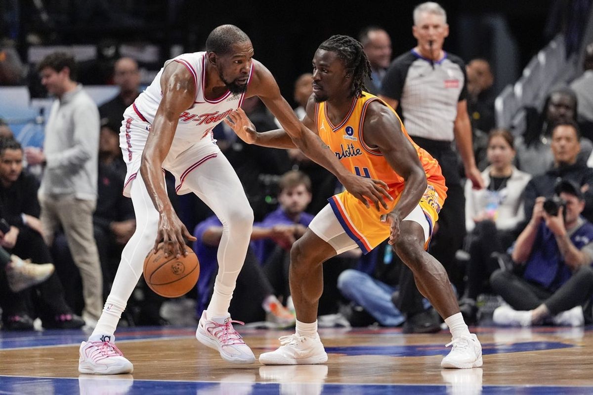 Feb 19, 2026; Charlotte, North Carolina, USA; Houston Rockets forward Kevin Durant (7) handles the ball defended by Charlotte Hornets guard Sion James (4) during the first quarter at Spectrum Center. Mandatory Credit: Jim Dedmon-Imagn Images