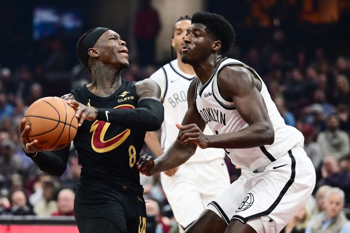 Feb 19, 2026; Cleveland, Ohio, USA; Cleveland Cavaliers guard Dennis Schroder (8) drives to the basket against Brooklyn Nets guard Drake Powell (4) during the second half at Rocket Arena. Mandatory Credit: Ken Blaze-Imagn Images