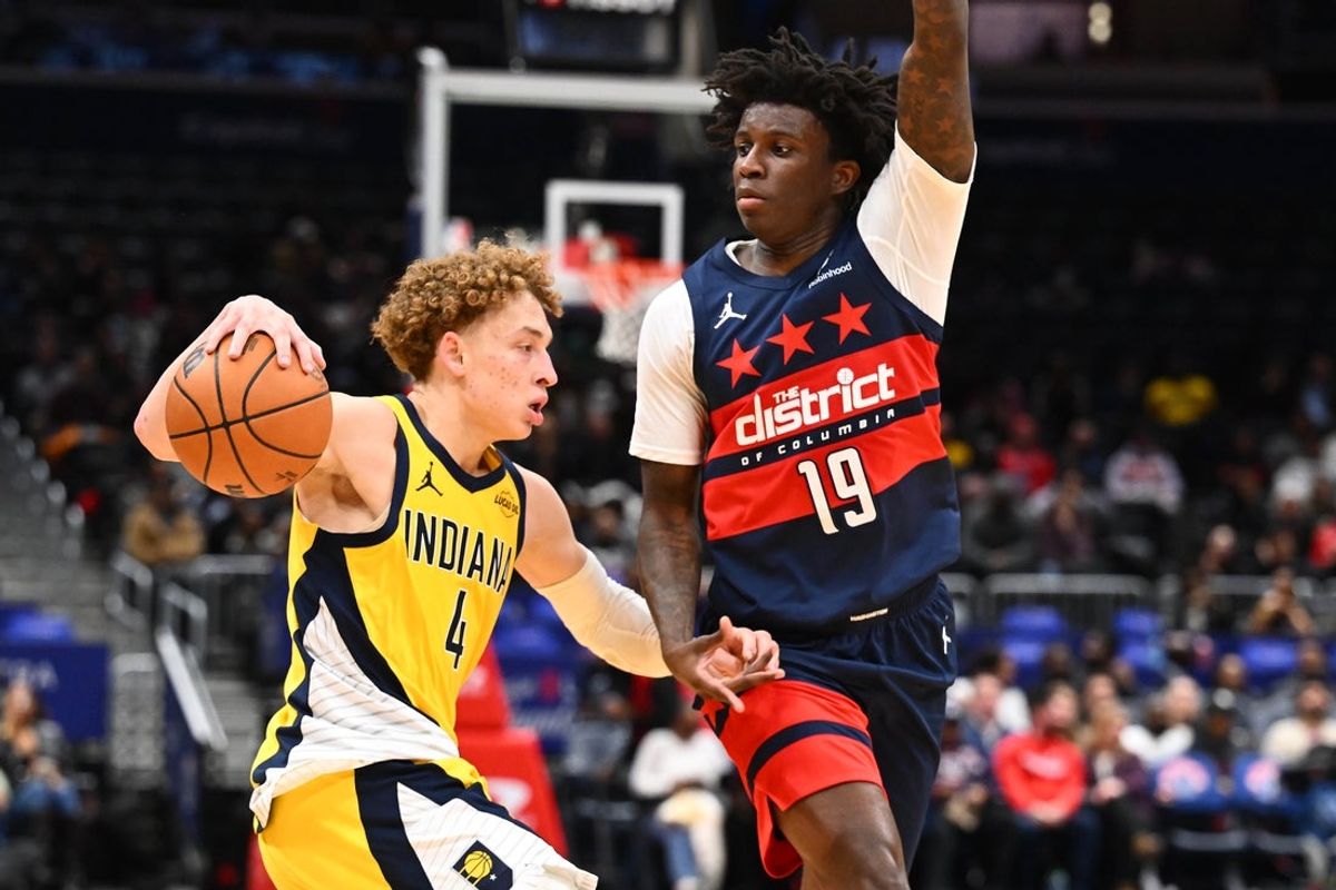 Feb 19, 2026; Washington, District of Columbia, USA; Indiana Pacers guard Taelon Peter (4) dribbles as Washington Wizards guard Kadary Richmond (19) defends during the second half at Capital One Arena. Mandatory Credit: Brad Mills-Imagn Images