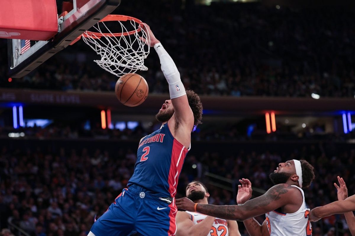 Feb 19, 2026; New York, New York, USA; Detroit Pistons guard Cade Cunningham (2) dunks against New York Knicks center Karl-Anthony Towns (32) during the second half at Madison Square Garden. Mandatory Credit: Vincent Carchietta-Imagn Images