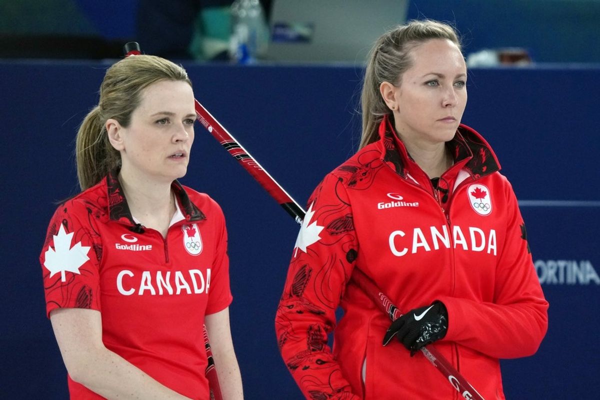 Feb 20, 2026; Cortina d'Ampezzo, Italy; Tracy Fleury and Rachel Homan of Canada during a women's curling semifinal game against Sweden during the Milano Cortina 2026 Olympic Winter Games at Cortina Curling Olympic Stadium. Mandatory Credit: Eric Bolte-Imagn Images
