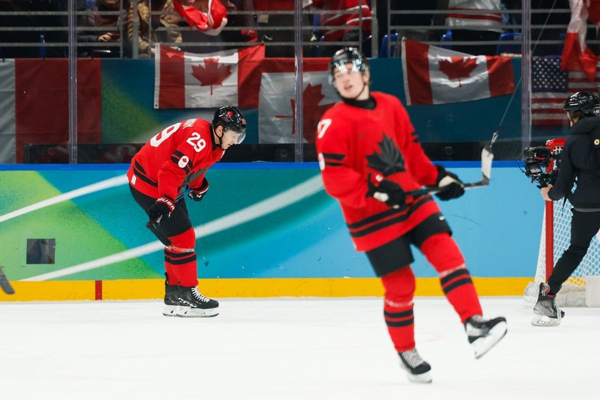 Feb 20, 2026; Milan, Italy; Nathan MacKinnon (29) of Canada celebrates after scoring a goal during the third period against Finland in a men's ice hockey semifinal during the Milano Cortina 2026 Olympic Winter Games at Milano Santagiulia Ice Hockey Arena. Mandatory Credit: Geoff Burke-Imagn Images