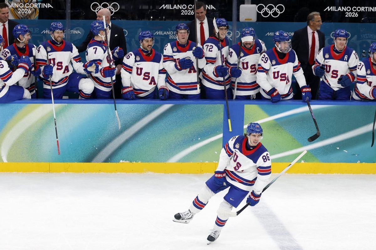 [US, Mexico & Canada customers only] Feb 20, 2026; Milan, Italy; Jack Hughes of United States celebrates scoring their third goal against Slovakia in a men's ice hockey semifinal during the Milano Cortina 2026 Olympic Winter Games at Milano Santagiulia Ice Hockey Arena. Mandatory Credit: David W Cerny/Reuters via Imagn Images