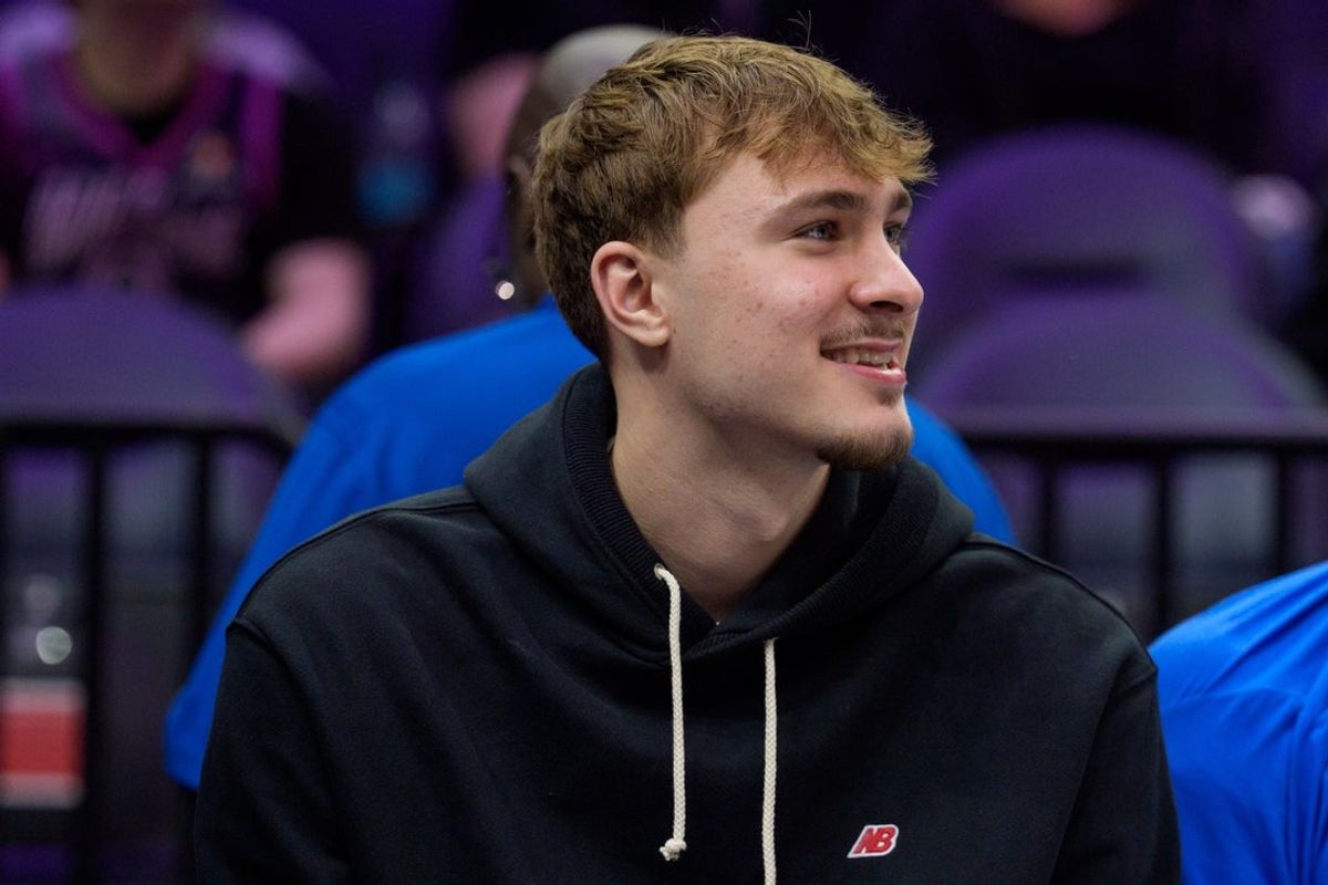 Feb 20, 2026; Minneapolis, Minnesota, USA; Dallas Mavericks forward Cooper Flagg (32) watches the second quarter against the Minnesota Timberwolves at Target Center. Mandatory Credit: Matt Blewett-Imagn Images