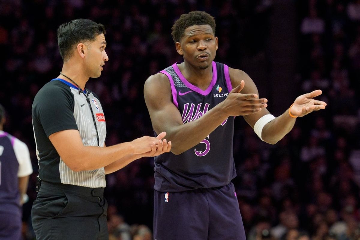 Feb 20, 2026; Minneapolis, Minnesota, USA; Minnesota Timberwolves guard Anthony Edwards (5) talks with referee Suyash Mehta (82) in the second quarter against the Dallas Mavericks at Target Center. Mandatory Credit: Matt Blewett-Imagn Images