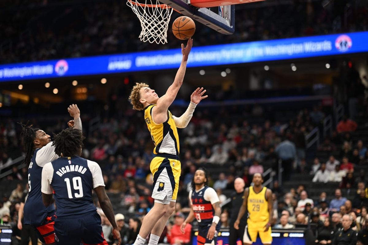 Feb 20, 2026; Washington, District of Columbia, USA; Indiana Pacers guard Taelon Peter (4) shoots against Washington Wizards guard Kadary Richmond (19) during the fourth quarter at Capital One Arena. Mandatory Credit: Rafael Suanes-Imagn Images