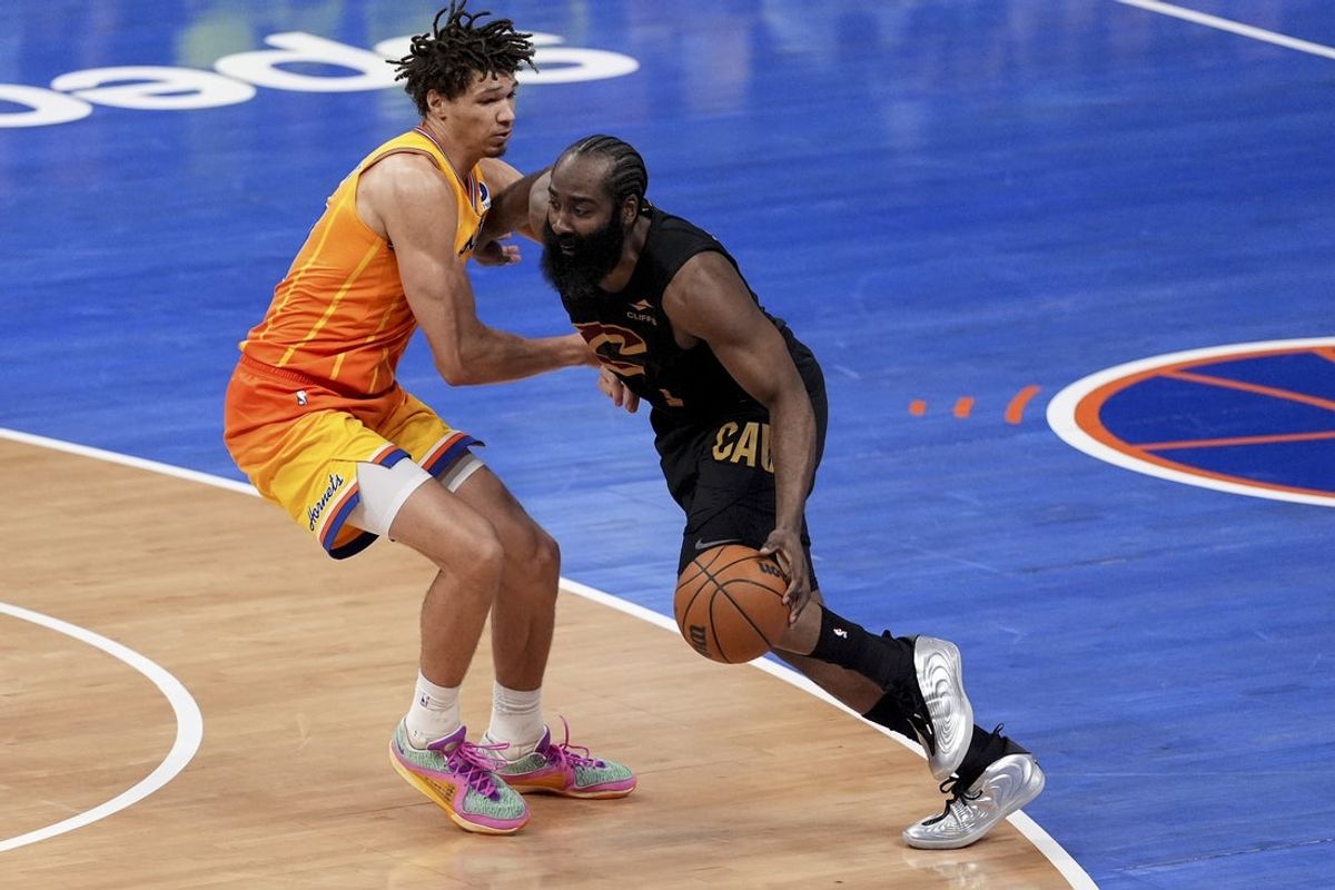 Feb 20, 2026; Charlotte, North Carolina, USA; Cleveland Cavaliers guard James Harden (1) drives against Charlotte Hornets forward Tidjane Salaun (31) during the second half at the Spectrum Center. Mandatory Credit: Jim Dedmon-Imagn Images