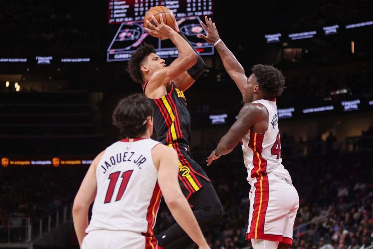Feb 20, 2026; Atlanta, Georgia, USA; Atlanta Hawks forward Jalen Johnson (1) shoots over Miami Heat guard Davion Mitchell (45) in the third quarter at State Farm Arena. Mandatory Credit: Brett Davis-Imagn Images