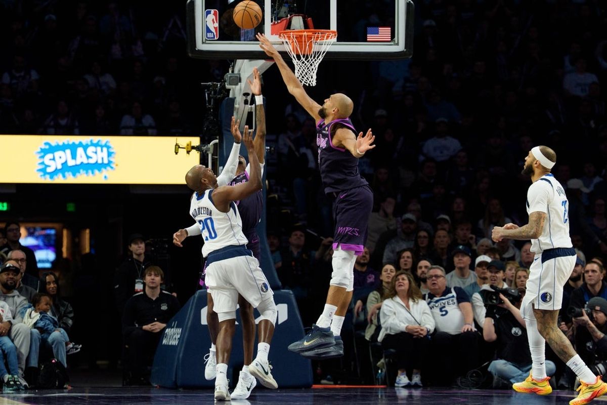 Feb 20, 2026; Minneapolis, Minnesota, USA; Minnesota Timberwolves center Rudy Gobert (27) attempts to block a shot by Dallas Mavericks forward Khris Middleton (20) in the fourth quarter at Target Center. Mandatory Credit: Matt Blewett-Imagn Images