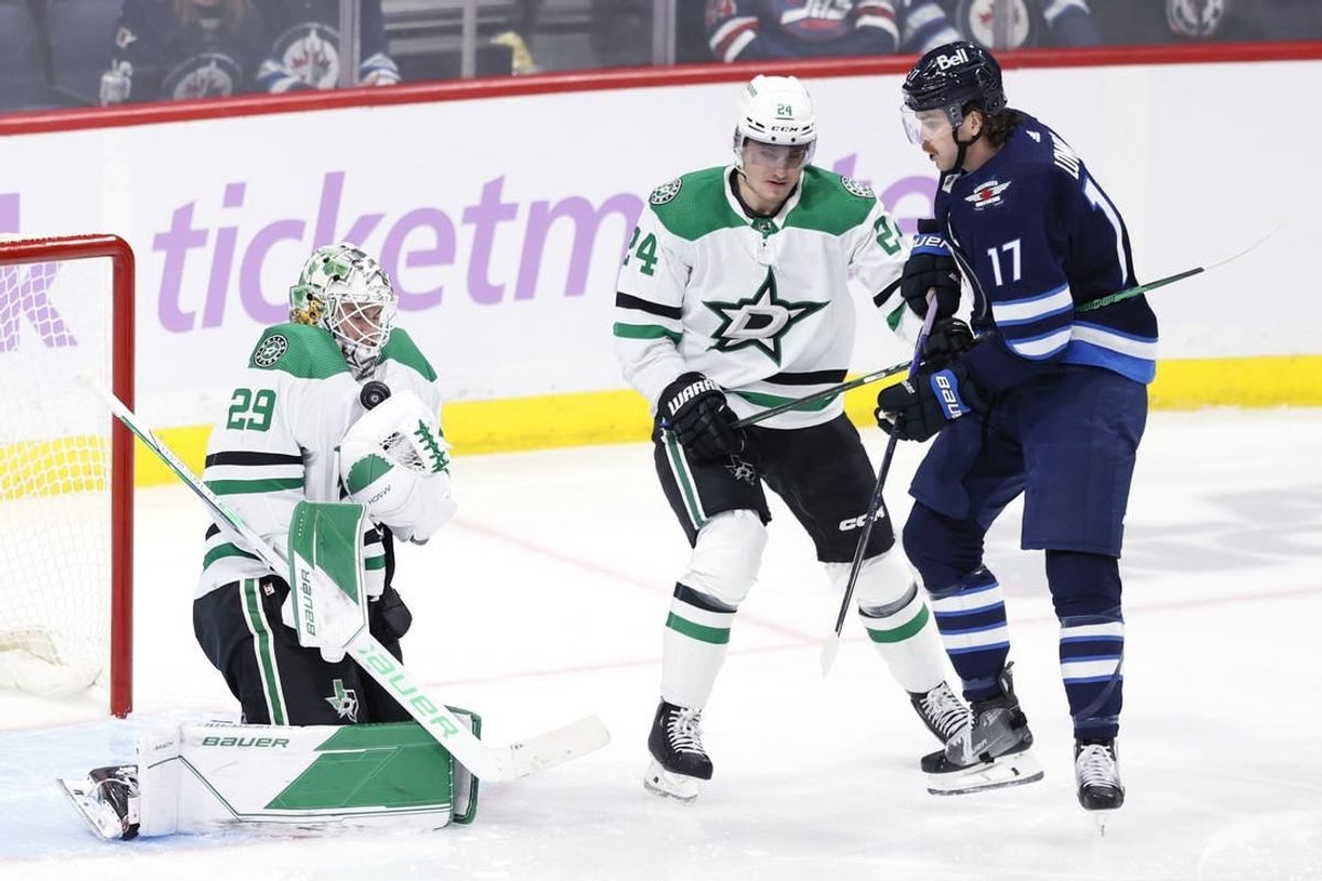 Nov 28, 2023; Winnipeg, Manitoba, CAN; Dallas Stars goaltender Jake Oettinger (29) blocks a shot by Winnipeg Jets center Adam Lowry (17) in the third period at Canada Life Centre.