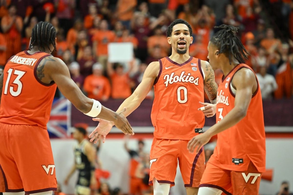 Feb 21, 2026; Blacksburg, Virginia, USA;  Virginia Tech Hokies guard Jailen Bedford (0) is congratulated by forward Amani Hansberry (13) and guard Ben Hammond (3) for a score during the first half against the Wake Forest Demon Deacons at Cassell Coliseum. Mandatory Credit: Brian Bishop-Imagn Images