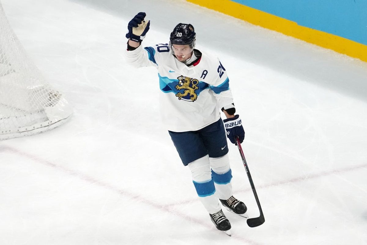 Feb 21, 2026; Milan, Italy; Sebastian Aho of Finland celebrates after scoring a goal against Slovakia in the men's ice hockey bronze medal game during the Milano Cortina 2026 Olympic Winter Games at Milano Santagiulia Ice Hockey Arena. Mandatory Credit: James Lang-Imagn Images