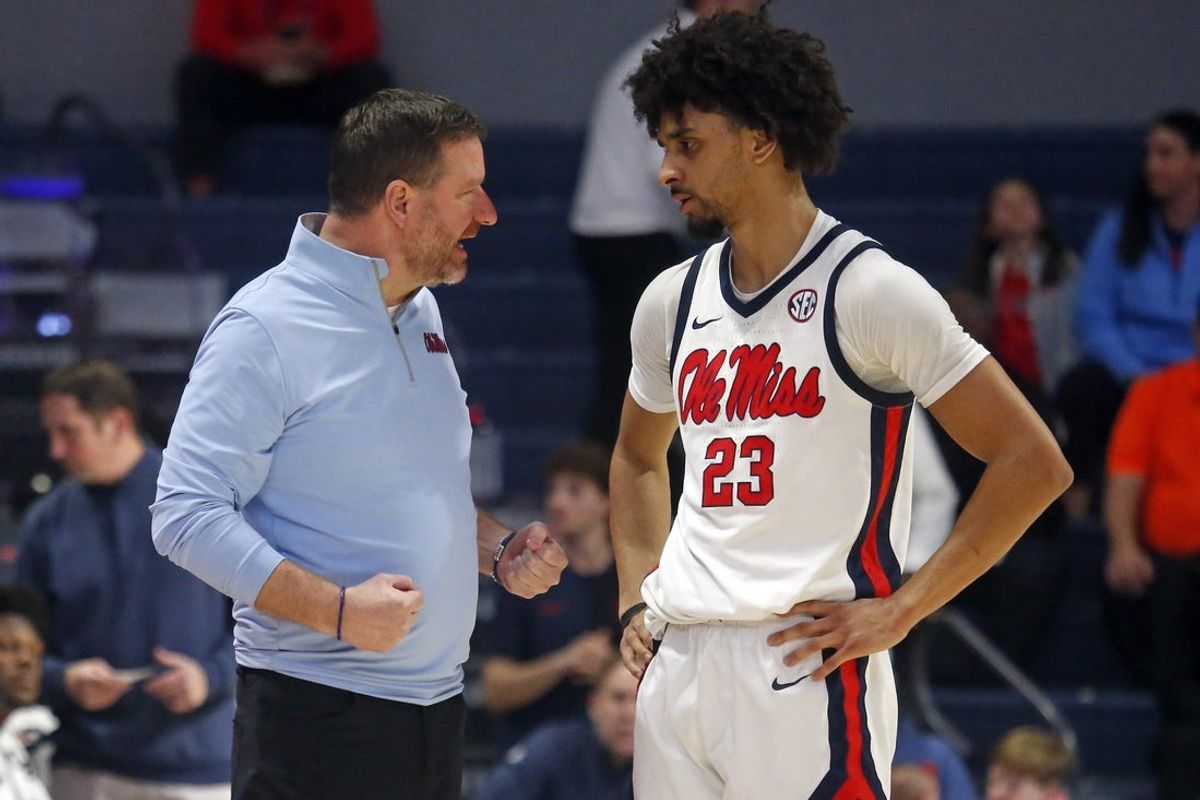 Feb 21, 2026; Oxford, Mississippi, USA; Mississippi Rebels head coach Chris Beard talks with guard Patton Pinkins (23) during the second half against the Florida Gators at The Sandy and John Black Pavilion at Ole Miss. Mandatory Credit: Petre Thomas-Imagn Images