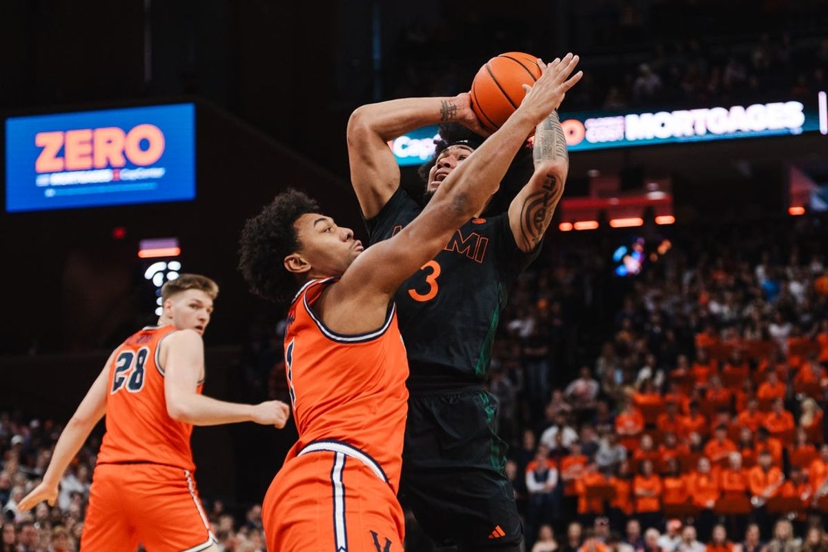 Feb 21, 2026; Charlottesville, Virginia, USA; Miami (FL) Hurricanes guard Tre Donaldson (3) shoots the ball while Virginia Cavaliers guard Malik Thomas (1) defends during the first half at John Paul Jones Arena. Mandatory Credit: Emily Faith Morgan-Imagn Images