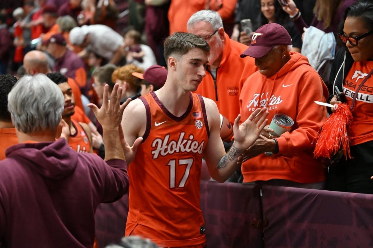 Feb 21, 2026; Blacksburg, Virginia, USA;  Virginia Tech Hokies guard Neoklis Avdalas (17) celebrates with fans after the game at Cassell Coliseum. Mandatory Credit: Brian Bishop-Imagn Images