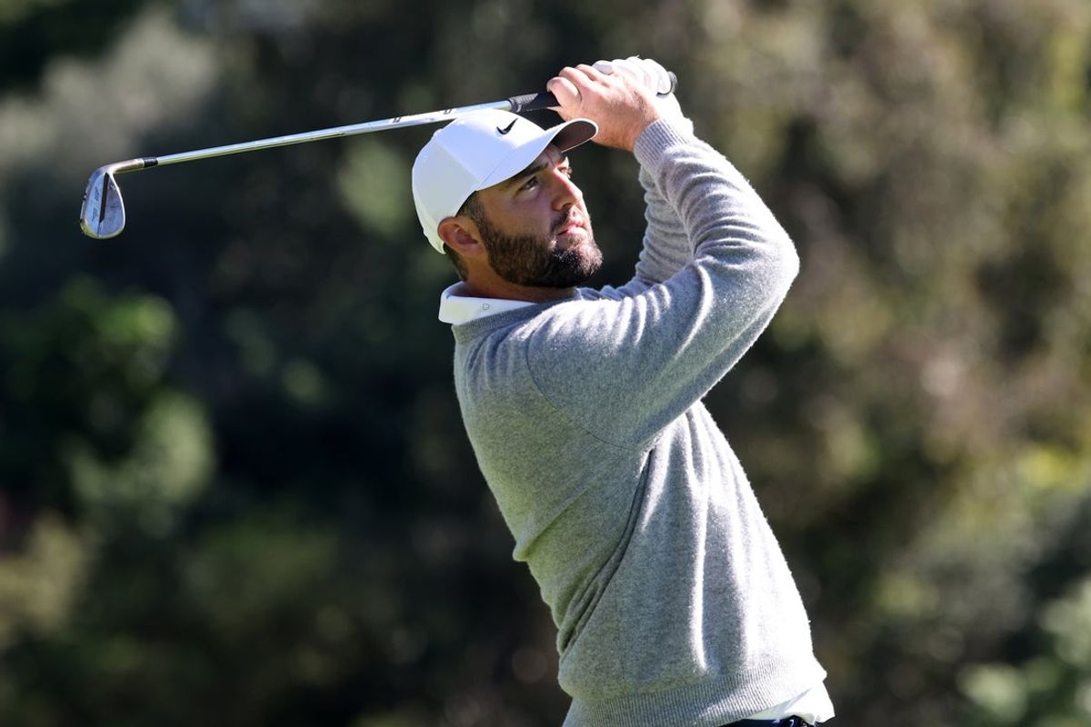 Feb 21, 2026; Pacific Palisades, California, USA;  Scottie Scheffler hits his fairway shot on on the 13th hole during the third round of the The Genesis Invitational golf tournament at Riviera Country Club. Mandatory Credit: Kiyoshi Mio-Imagn Images