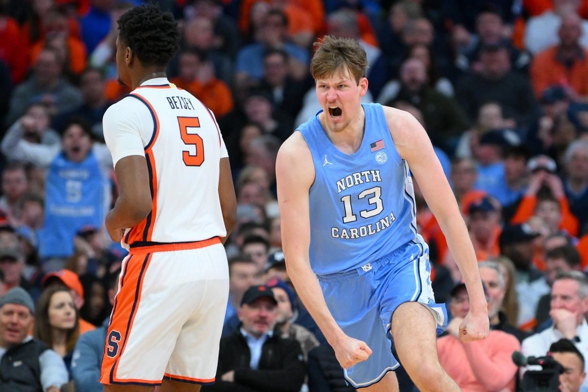 Feb 21, 2026; Syracuse, New York, USA; North Carolina Tar Heels center Henri Veesaar (13) reacts to a play past Syracuse Orange forward Tyler Betsey (5) during the second half at the JMA Wireless Dome. Mandatory Credit: Rich Barnes-Imagn Images