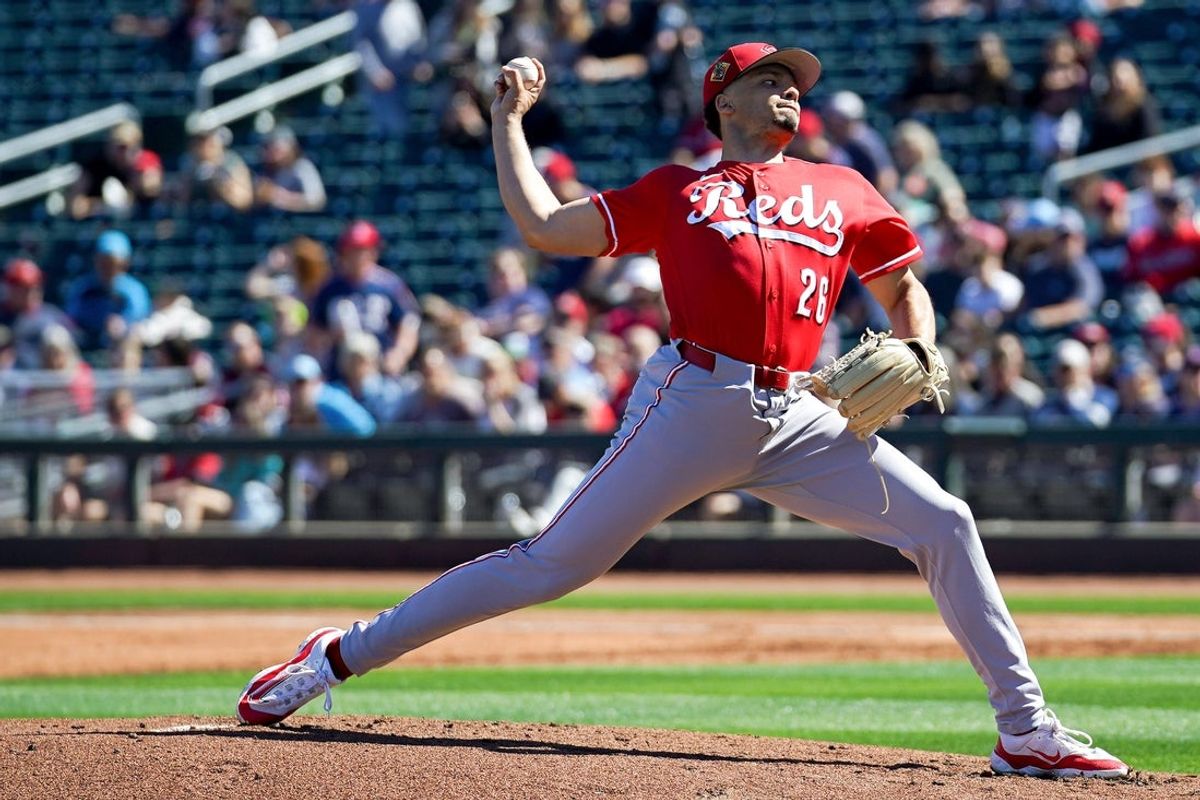 Cincinnati Reds pitcher Chase Burns (26) delivers a pitch in the first inning of a Cactus League game between the Cincinnati Reds and Cleveland Guardians, Saturday, Feb. 21, 2026, at Goodyear Ballpark in Goodyear, Ariz.