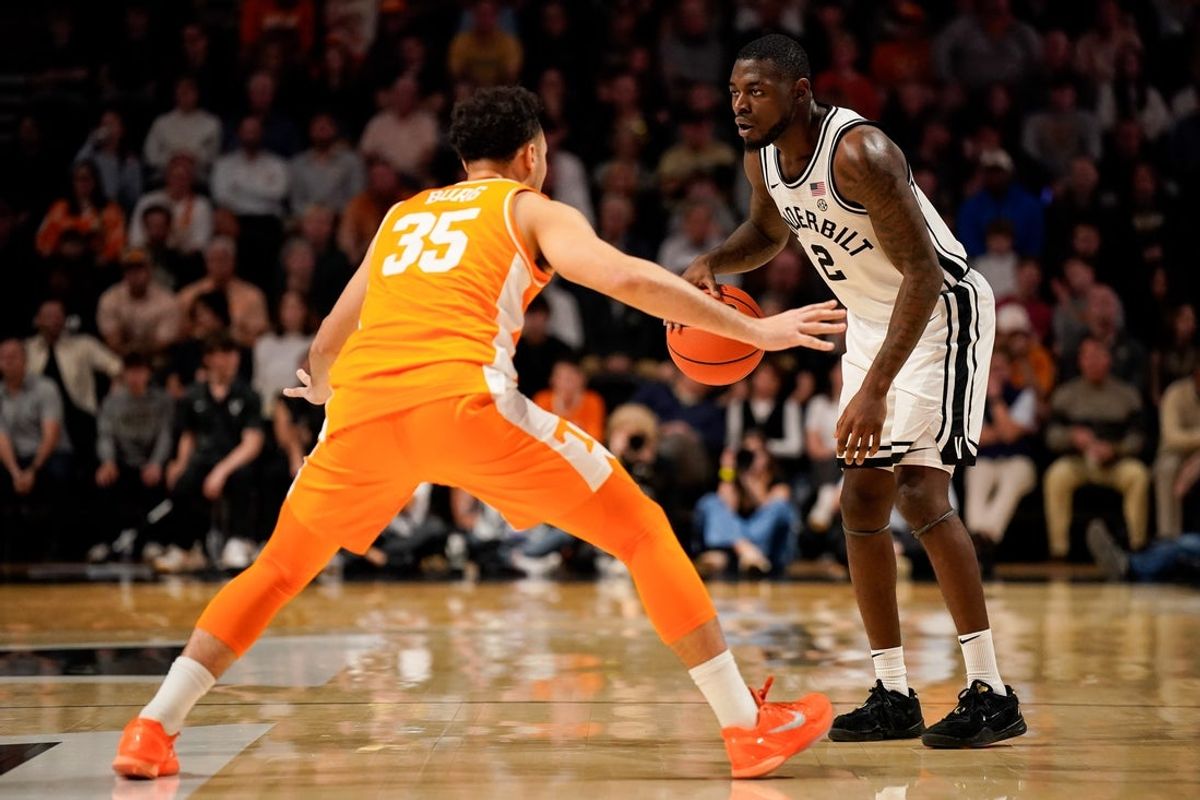 Vanderbilt guard Duke Miles (2) looks for an opening against Tennessee guard Ethan Burg (35) during the second half at Memorial Gym in Nashville, Tenn., Saturday, Feb. 21, 2026.
