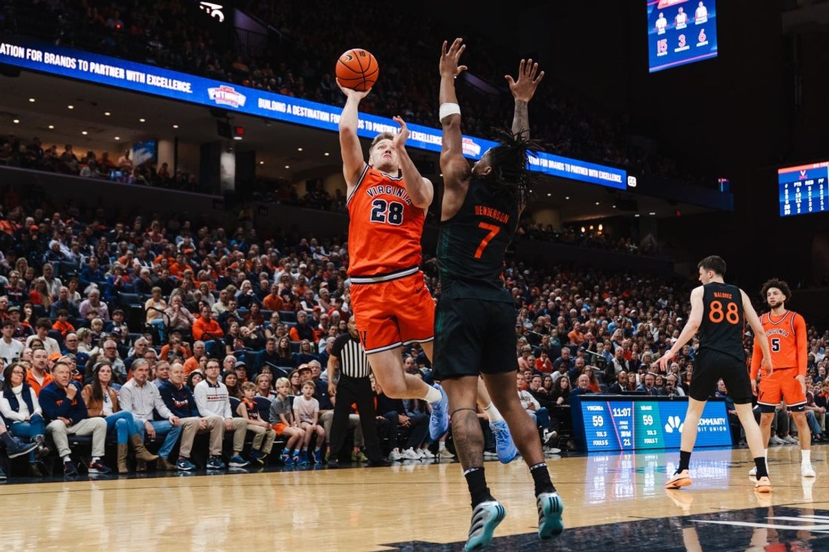 Feb 21, 2026; Charlottesville, Virginia, USA; Virginia Cavaliers forward Thijs de Ridder (28) shoots the ball over Miami (FL) Hurricanes forward Shelton Henderson (7) during the second half at John Paul Jones Arena. Mandatory Credit: Emily Faith Morgan-Imagn Images