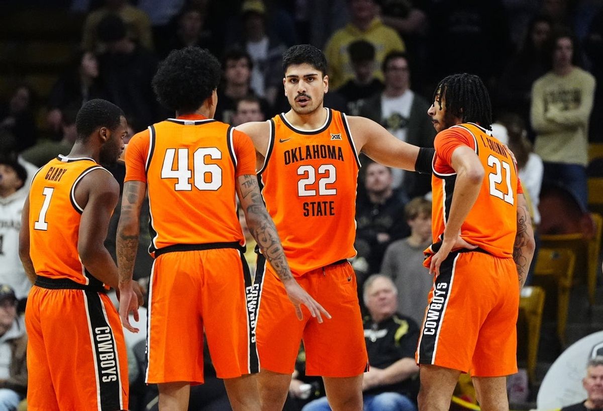 Feb 21, 2026; Boulder, Colorado, USA; Oklahoma State Cowboys center Parsa Fallah (22) huddles his teammates in the second half against the Colorado Buffaloes at the CU Events Center. Mandatory Credit: Ron Chenoy-Imagn Images