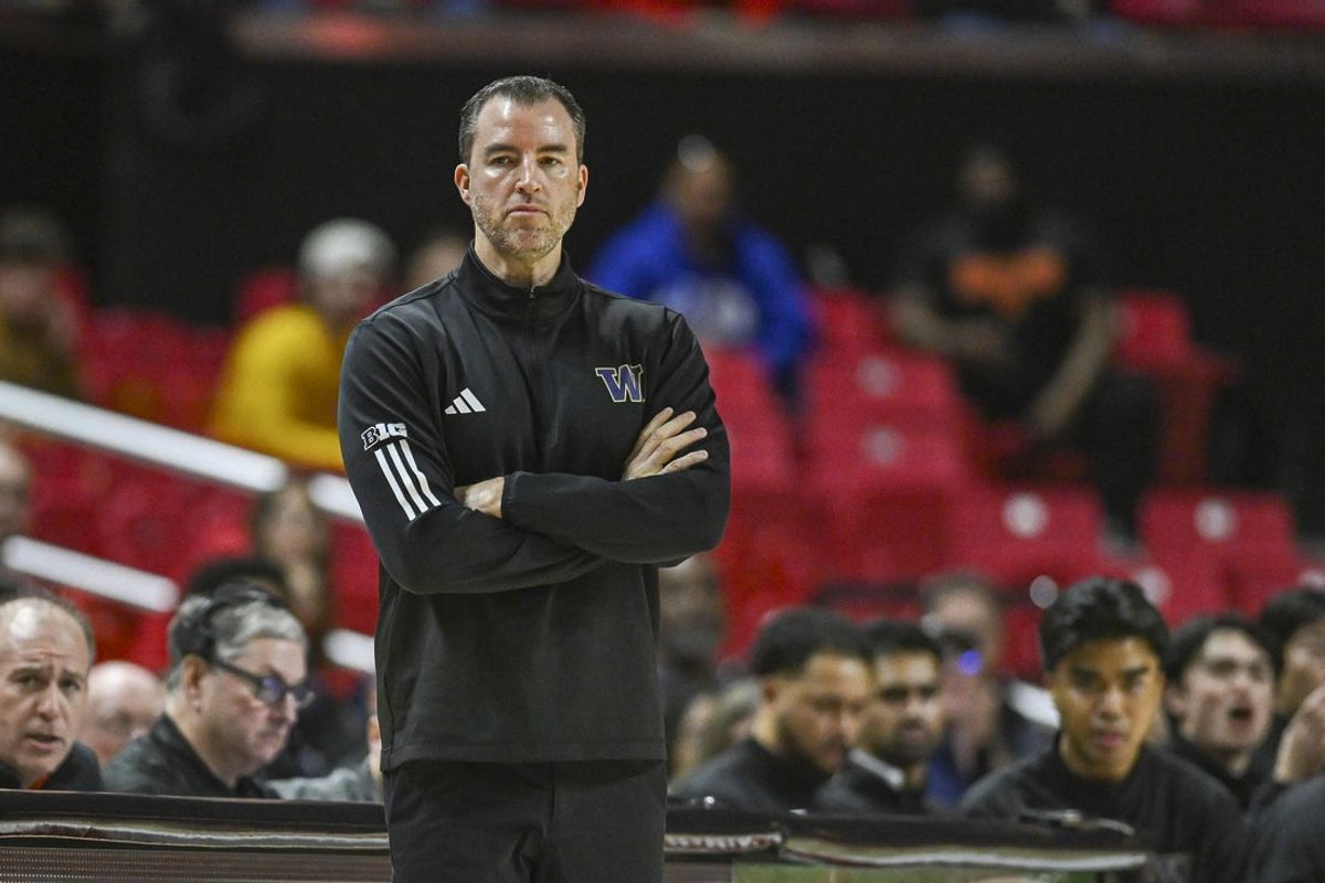 Feb 21, 2026; College Park, Maryland, USA;  Washington Huskies head coach Danny Sprinkle looks onto the court during the first half against the Maryland Terrapins at Xfinity Center. Mandatory Credit: Tommy Gilligan-Imagn Images