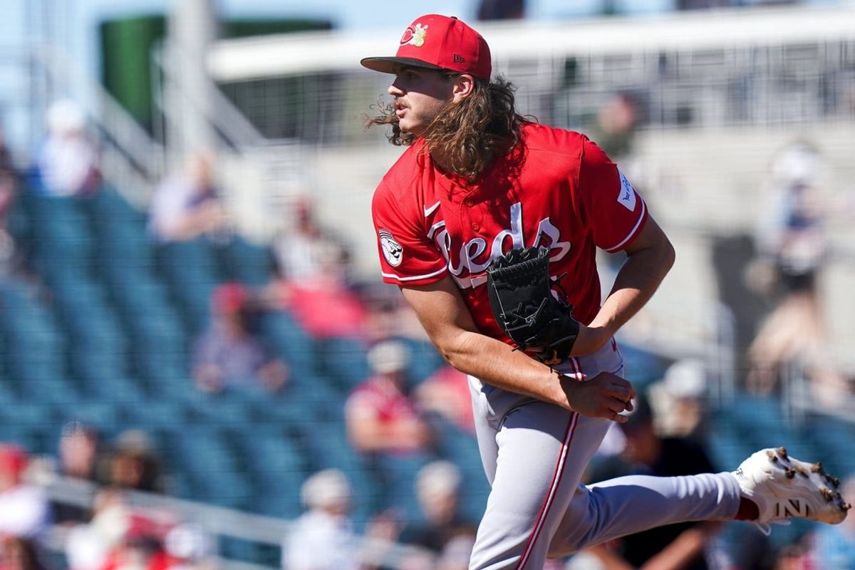 Cincinnati Reds pitcher Rhett Lowder (25) delivers a pitch in the third inning of a Cactus League game between the Cincinnati Reds and Cleveland Guardians, Saturday, Feb. 21, 2026, at Goodyear Ballpark in Goodyear, Ariz.