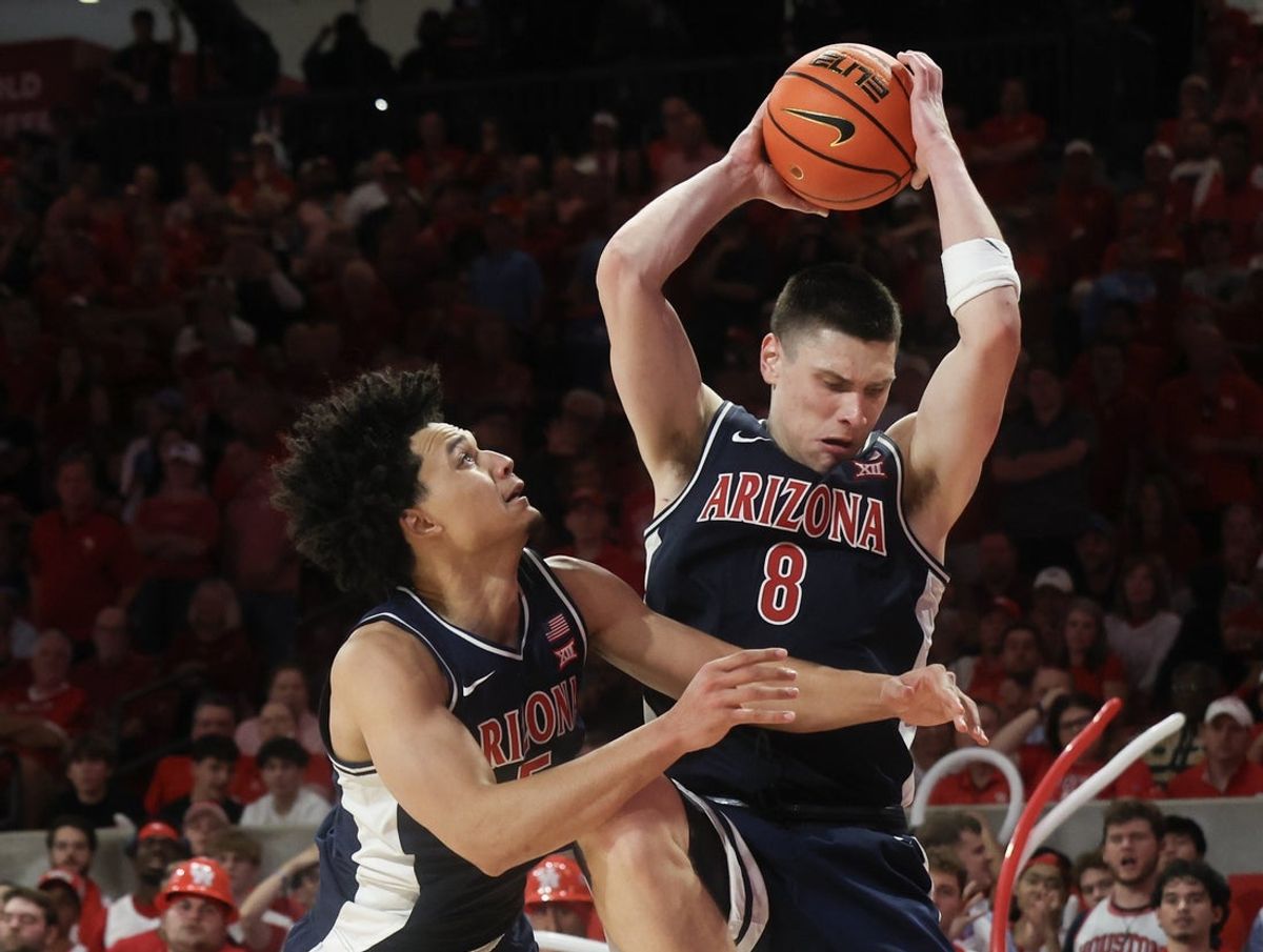 Feb 21, 2026; Houston, Texas, USA;  Arizona Wildcats forward Ivan Kharchenkov (8) grabs a defensive rebound against the Houston Cougars in the second half at Fertitta Center. Mandatory Credit: Thomas Shea-Imagn Images
