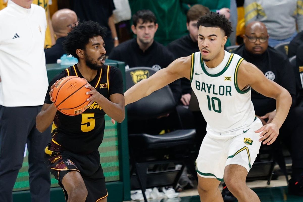 Feb 21, 2026; Waco, Texas, USA; Arizona State Sun Devils guard Maurice Odum (5) looks to pass against Baylor Bears guard Isaac Williams (10) during the second half at Paul and Alejandra Foster Pavilion. Mandatory Credit: Chris Jones-Imagn Images